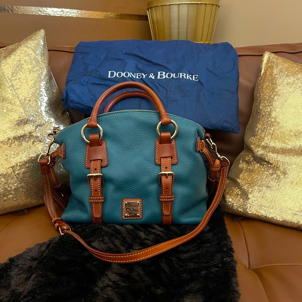 Turquoise pebble leather Dooney & Bourke bag with a small coin purse.
